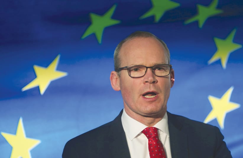 Irish Minister for Foreign Affairs Simon Coveney speaks at the launch of his party’s manifesto for the Irish general election, in Dublin, in January 2020. (photo credit: LORRAINE O’SULLIVAN/REUTERS)