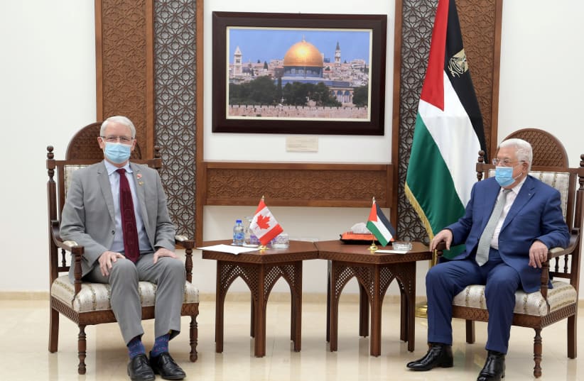 Canadian Foreign Minister Marc Garneau meets with Palestinian President Mahmoud Abbas, in Ramallah in the West Bank July 5, 2021. (photo credit: PALESTINIAN PRESIDENT OFFICE (PPO)/HANDOUT VIA REUTERS)