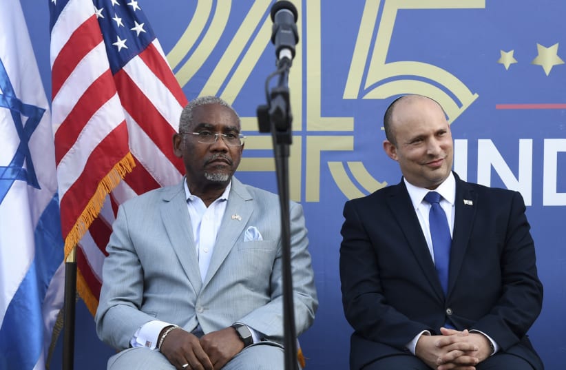 Rep. Gregory Meeks (New York) and Prime Minister Naftali Bennett attend the US Embassy in Israel's annual US Independence Day event, on July 6, 2021. (photo credit: DAVID AZAGURY/US EMBASSY JERUSALEM)