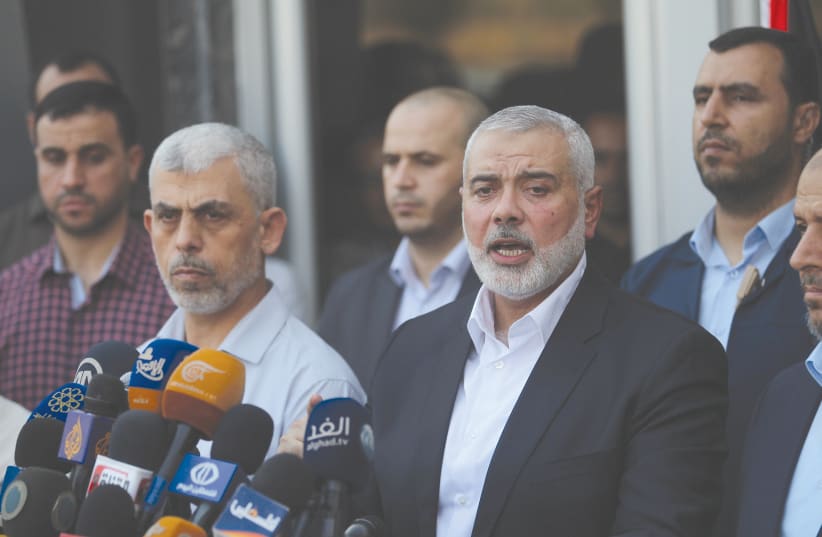 HAMAS CHIEF Ismail Haniyeh speaks to the press upon his arrival at the Rafah border crossing in the southern Gaza Strip in 2017. (photo credit: ABED RAHIM KHATIB/FLASH90)
