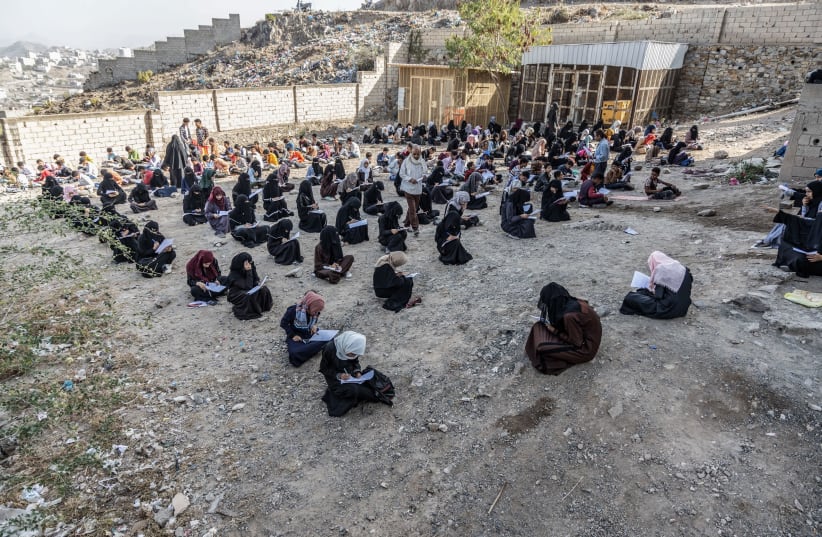 Kholood and her classmates take exams in the schoolyard due to the lack of space inside the school building, Taizz, Yemen, 2021. (photo credit: UNICEF/AL-BASHA)