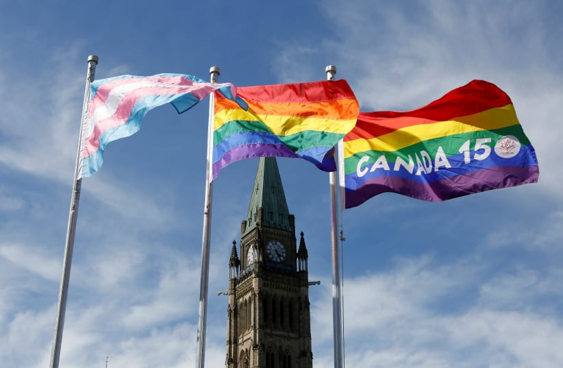THE TRANSGENDER pride, pride and Canada 150 pride flags fly in Ottawa, 2017.  (photo credit: CHRIS WATTIE/REUTERS)