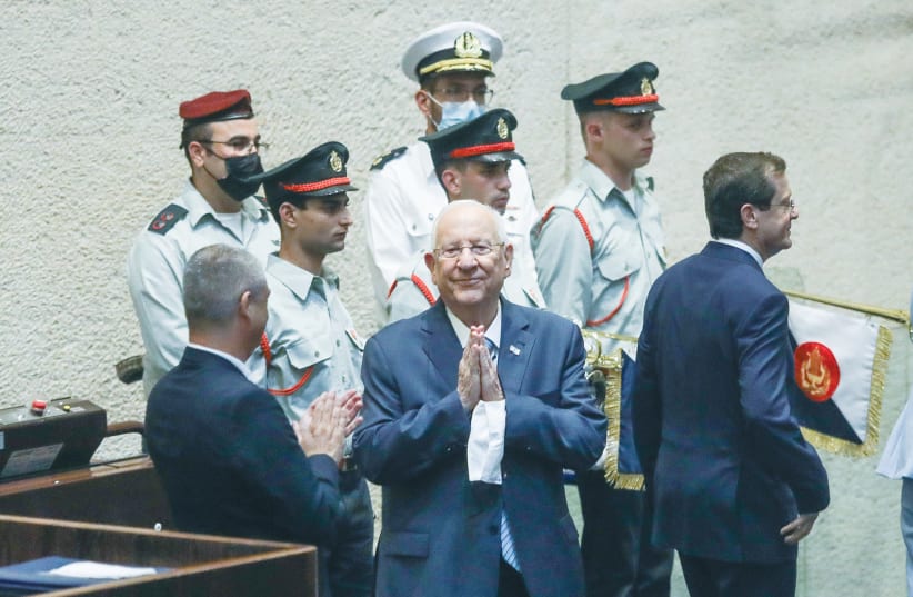 Outgoing-President Reuven Rivlin makes a parting gesture during the inauguration ceremony for his successor, Isaac Herzog (right). (photo credit: MARC ISRAEL SELLEM/THE JERUSALEM POST)