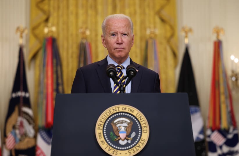US President Joe Biden points a finger as he delivers remarks on the administration's continued drawdown efforts in Afghanistan in a speech from the East Room at the White House in Washington US, July 8, 2021. (photo credit: EVELYN HOCKSTEIN/REUTERS)