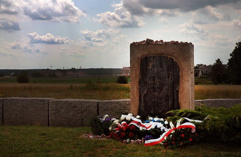 Memorial in Jedwabne, dedicated to murdered Jews: "In remembrance of the Jews from Jedwabne and surrounding areas, men, women, children, co-habitants of this earth, murdered, burned alive here on July 10th, 1941" (photo credit: Wikimedia Commons)