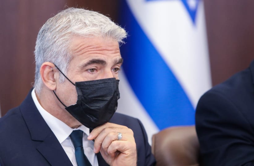 Yair Lapid at a government meeting on July 11, 2021. (photo credit: MARC ISRAEL SELLEM)