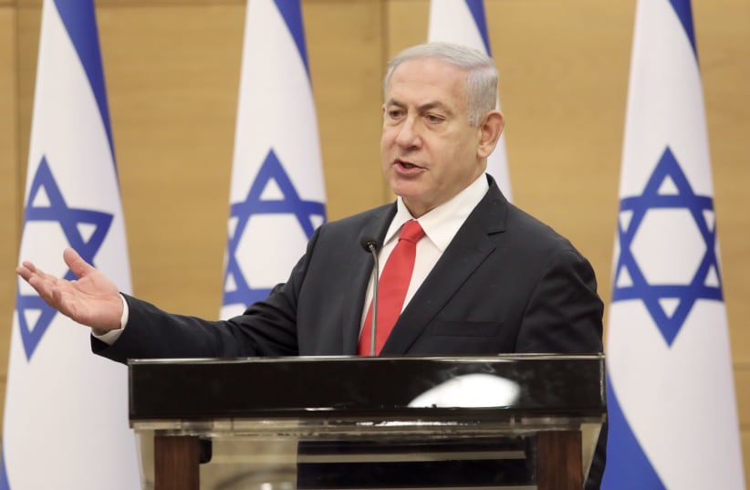 Opposition leader Benjamin Netanyahu is seen at the Knesset, on July 12, 2021. (photo credit: MARC ISRAEL SELLEM/THE JERUSALEM POST)