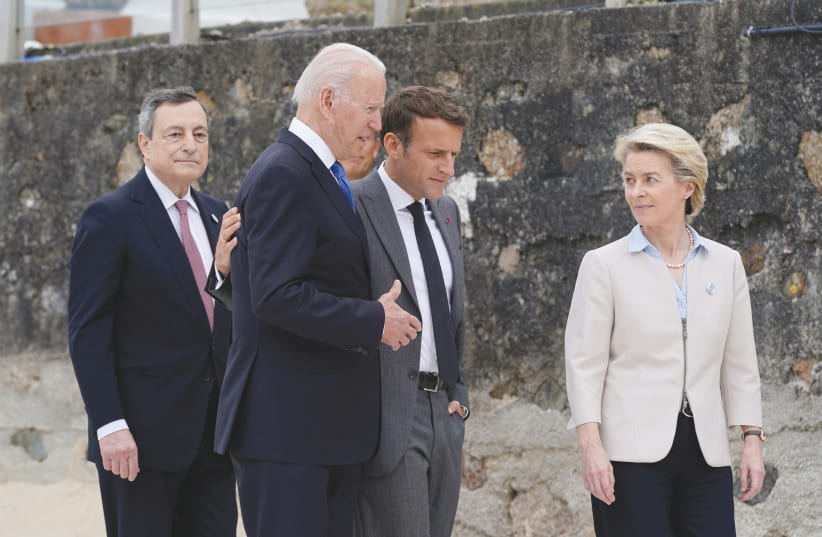 US President Joe Biden walks with Italian Prime Minister Mario Draghi, France’s President Emmanuel Macron and European Commission President Ursula von der Leyen after posing for the group photo at the G7 summit, in Britain last month. (photo credit: PATRICK SEMANSKY/POOL VIA REUTERS)