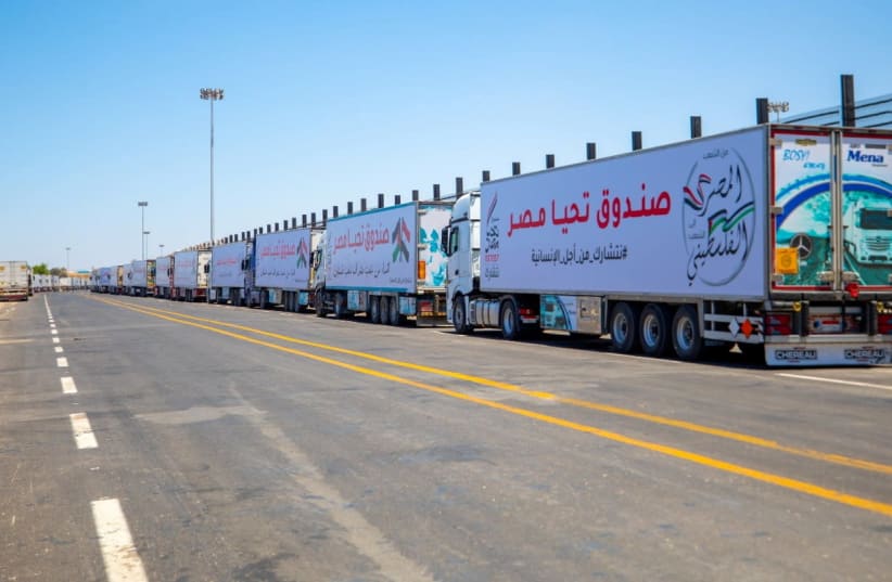 An aid convoy's trucks loaded with supplies send by Long Live Egypt Fund are seen at the Rafah border crossing between Egypt and the Gaza Strip, in this handout picture obtained by Reuters on May 23, 2021.  (photo credit: THE EGYPTIAN PRESIDENCY/HANDOUT VIA REUTERS)