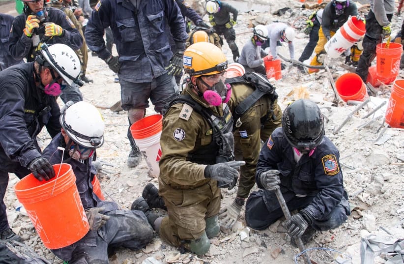 IDF soldiers are seen aiding in the search and rescue operation in Florida following the collapse of a building in Surfside. (photo credit: IDF SPOKESPERSON'S UNIT)