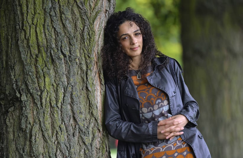 Masih Alinejad, 37, a Britain-based Iranian journalist, poses for a portrait in London October 8, 2013 (photo credit: TOBY MELVILLE/REUTERS)