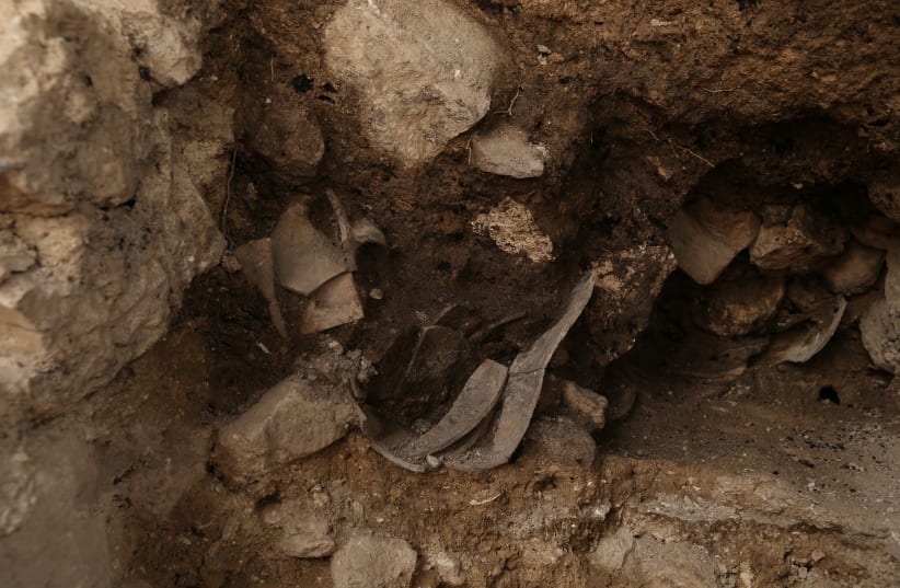 Remains of destruction discovered near the wall from previous excavations.  (photo credit: ELIYAHU YANAI/CITY OF DAVID ARCHIVES)