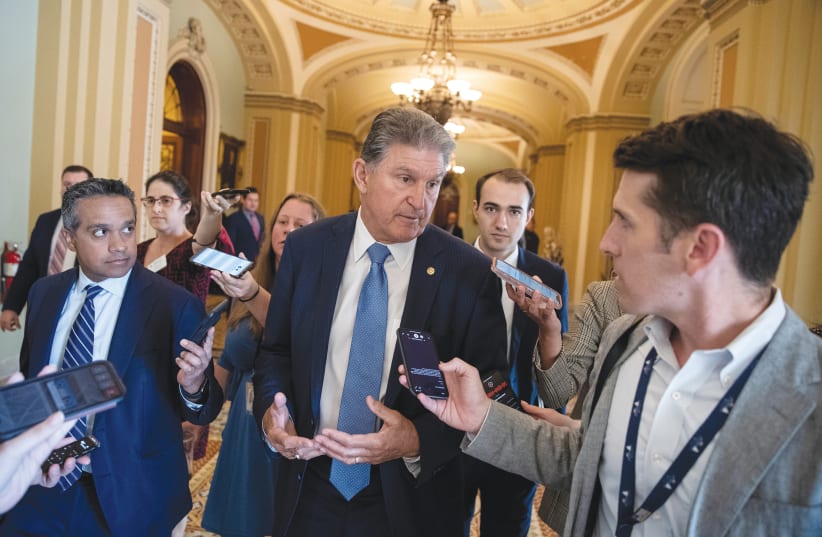 SEN. JOE MANCHIN speaks to news reporters on Capitol Hill in Washington last month. (photo credit: TOM BRENNER/REUTERS)