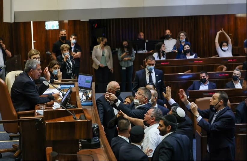 Opposition members surrounding the seat of Knesset Speaker, demanding the vote results not be changed, July 15, 2021.  (photo credit: NOAM MOSCOWITZ/KNESSET SPOKESMAN'S OFFICE)