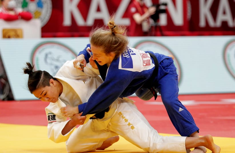 Israeli judoka attempts to ippon her opponent. (photo credit: REUTERS)
