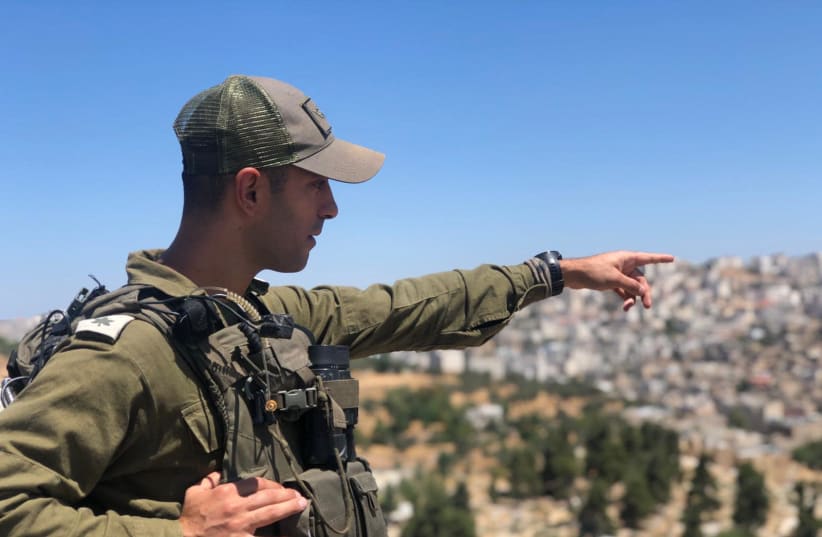 Lt.-Col. Omri Mashiach outside the city of Hebron.  (photo credit: IDF SPOKESPERSON'S UNIT)