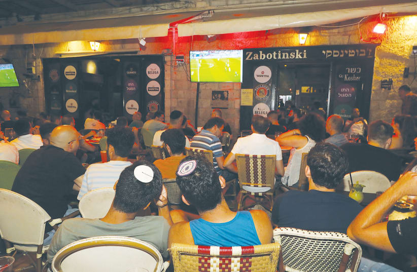 FOOTBALL FANS gather in Jerusalem to watch England play Italy in the UEFA final. (photo credit: MARC ISRAEL SELLEM/THE JERUSALEM POST)