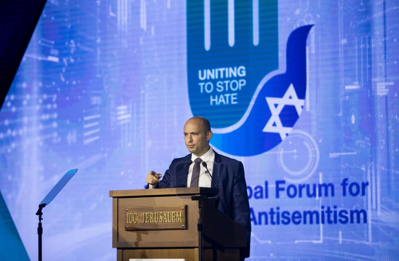 Then-Education Minister Naftali Bennett speaks during the 6th Global Forum for Combating Antisemitism conference at the Jerusalem Convention Center, on March 19, 2018 (photo credit: YONATAN SINDEL/FLASH 90)