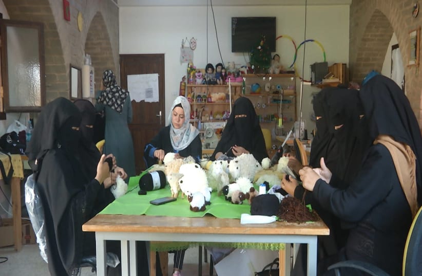 Women at work at the toy factory supported by the Zeina Cooperative Association in the northern Gaza village of Om Alnasser on July 15, 2021. (photo credit: HAZEM ALBAZ/THE MEDIA LINE)