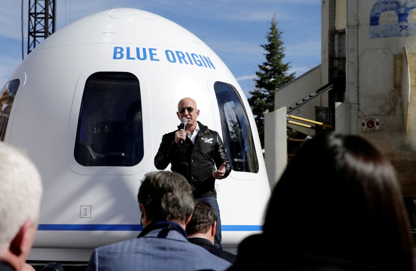 Amazon and Blue Origin founder Jeff Bezos addresses the media about the New Shepard rocket booster and Crew Capsule mockup at the 33rd Space Symposium in Colorado Springs, Colorado, United States April 5, 2017. (photo credit: REUTERS/ISAIAH J. DOWNING/FILE PHOTO)
