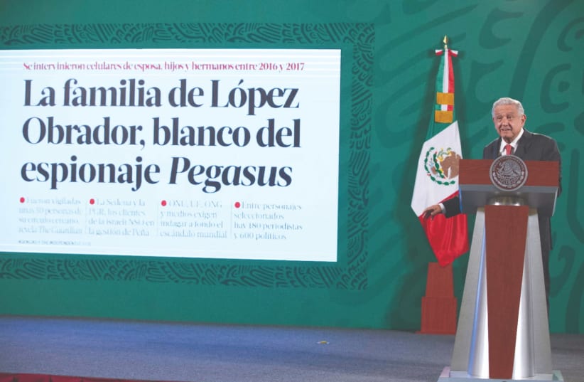 MEXICAN PRESIDENT Andres Manuel Lopez Obrador speaks about being targeted by the administration of Enrique Pena Nieto after it purchased spying software from Israel-based NSO Group, at the National Palace in Mexico City on Tuesday.  (photo credit: MEXICO'S PRESIDENCY/HANDOUT VIA REUTERS)