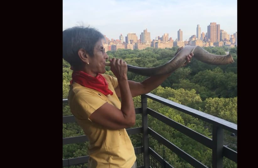 Since the early days of the pandemic, Rabbi Janise Poticha has kept up her shofar-blowing at 7 p.m. daily as a salute to health care workers. (photo credit: LYDIA ORIAS/JTA)