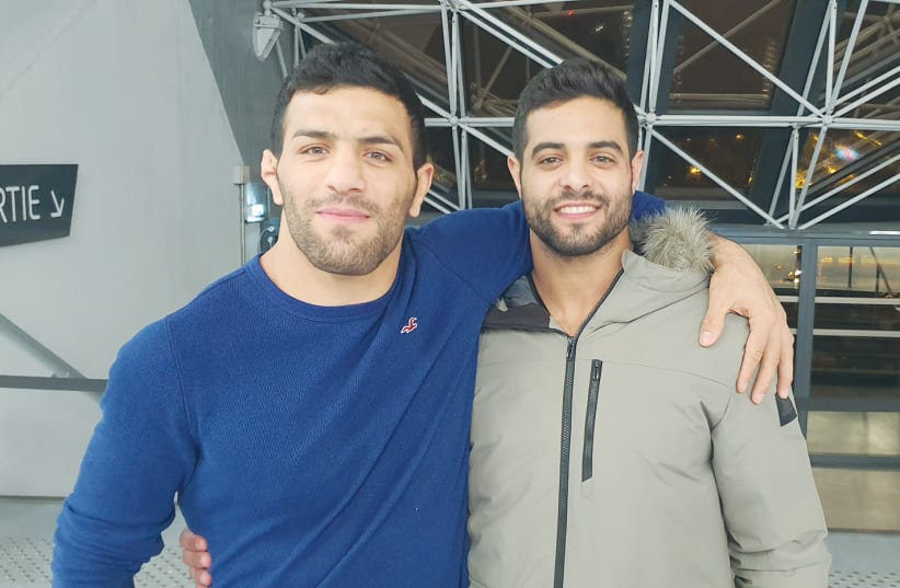 ISRAELI AND IRANIAN judo world champions Sagi Muki (right) and Saeid Mollaei offer hope that conflicts in a difficult region can be overcome through the power of relationships. (photo credit: Courtesy)