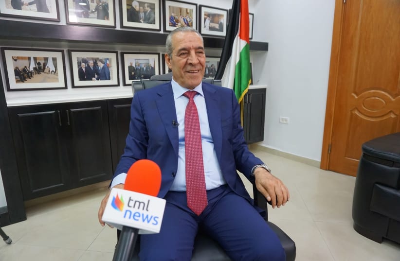 Palestinian Authority Civil Affairs Minister Hussein Al-Sheikh speaks to The Media Line in his office in Ramallah. (photo credit: THE MEDIA LINE)