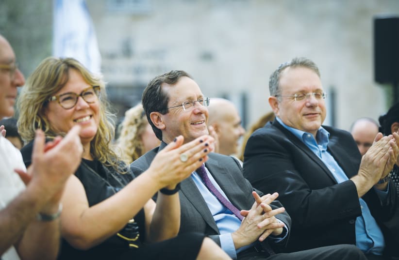 PRESIDENT ISAAC HERZOG and WZO chairman Yaakov Hagoel attend a ceremony in honor of Herzog at the Jewish Agency in Jerusalem on July 5.  (photo credit: NOAM REVKIN FENTON / FLASH 90)