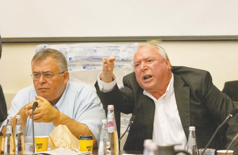 MKS DAVID AMSALEM (right) and David Bitan react during a meeting in the Knesset earlier this month. (photo credit: YONATAN SINDEL/FLASH 90)