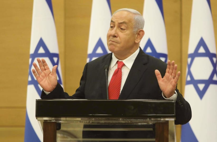 Israel's opposition leader Benjamin Netanyahu is seen gesturing at the Knesset, on July 26, 2021. (photo credit: MARC ISRAEL SELLEM/THE JERUSALEM POST)