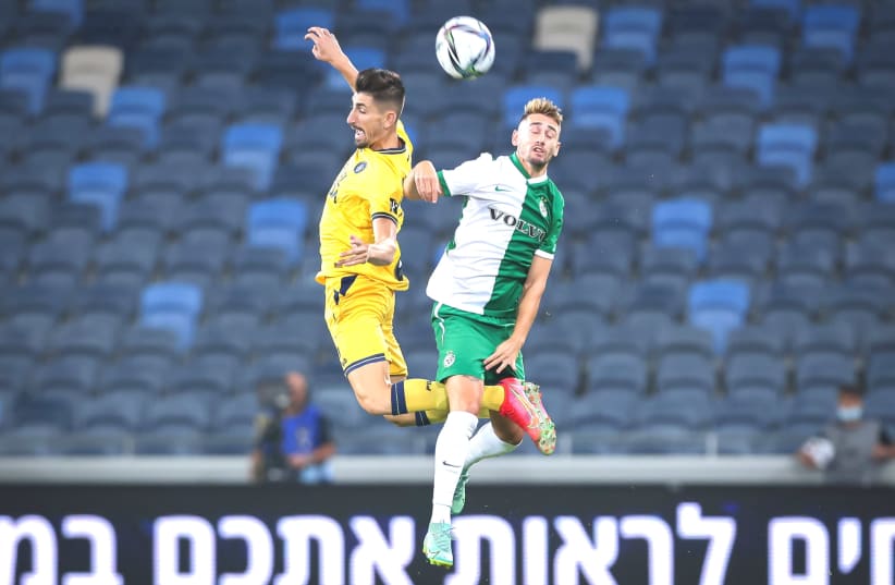 MACCABI HAIFA and Maccabi Tel Aviv (in yellow) clashed in Sunday night's Israel Super Cup, with the Greens emerging with a 2-0 victory to capture the crown. (photo credit: MAOR ELKASLASI)