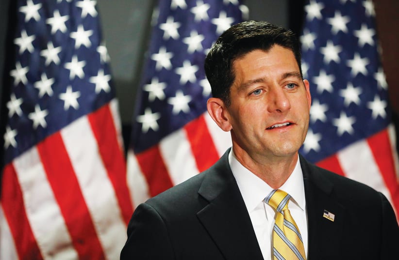 FORMER US speaker of the House Paul Ryan speaks to the press in Washington, in 2017. (photo credit: AARON P. BERNSTEIN/ REUTERS)