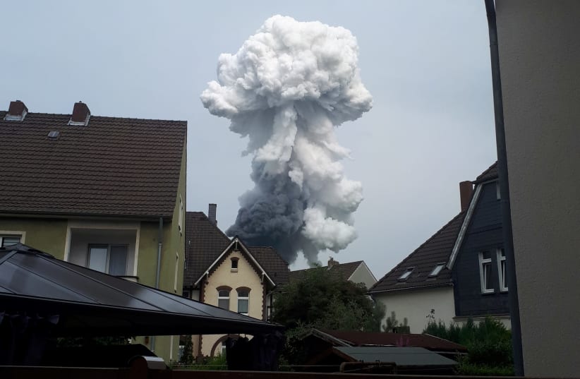 Smoke billows following an explosion in Wiesdorf, Leverkusen, Germany July 27, 2021 (photo credit: REUTERS / ANNA FROSS)