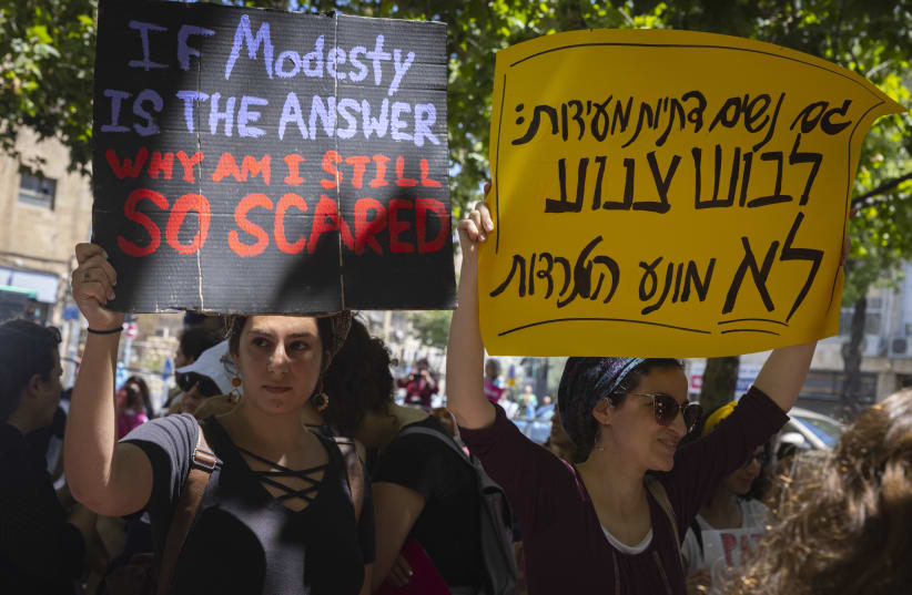 Israeli protesters chant slogans as they march in the SlutWalk in central Jerusalem, on June 18, 2021. (photo credit: OLIVIER FITOUSSI/FLASH90)