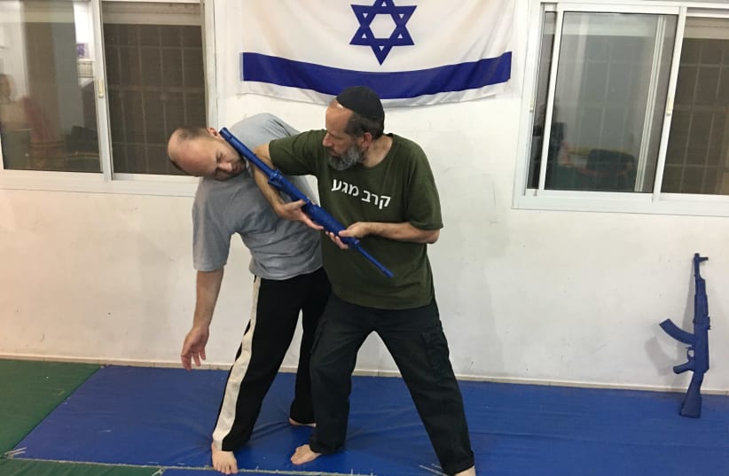 Katz demonstrates Krav Maga with a colleague.  ‘We rely on sound techniques and the natural body movement.’ (photo credit: Courtesy)