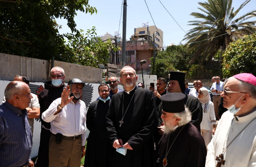Latin Patriarch of Jerusalem Pierbattista Pizzaballa looks on during his visit to the flashpoint neighborhood of Sheikh Jarrah in east Jerusalem July 28, 2021. (photo credit: RONEN ZVULUN/REUTERS)
