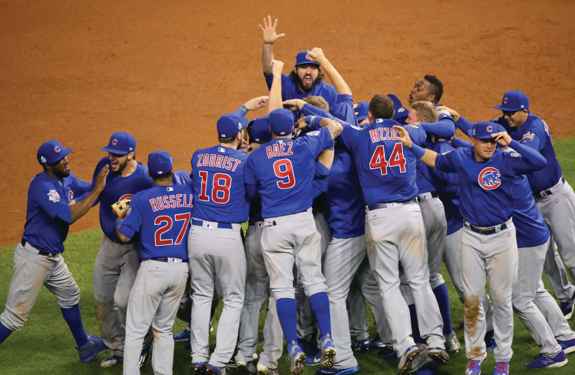  The Chicago Cubs celebrate after winning the 2016 World Series (photo credit: Wikimedia Commons)