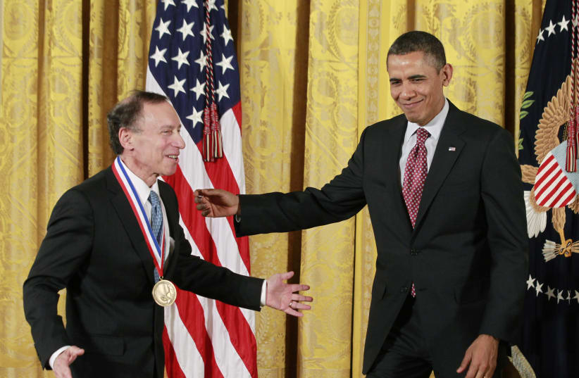 US president Barack Obama gets ready for a picture with National Medal of Technology and Innovation recipient Dr. Robert Langer from the Massachusetts Institute of Technology during a ceremony in the East Room of the White House in Washington, February 1, 2013. (photo credit: JASON REED/REUTERS)