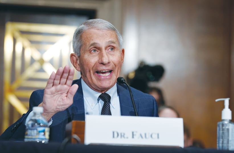 TOP INFECTIOUS disease expert Dr. Anthony Fauci responds to accusations by Sen. Rand Paul during testimony before the US Senate Health, Education, Labor, and Pensions Committee on Capitol Hill in Washington earlier this month. (photo credit: J. SCOTT APPLEWHITE/REUTERS)