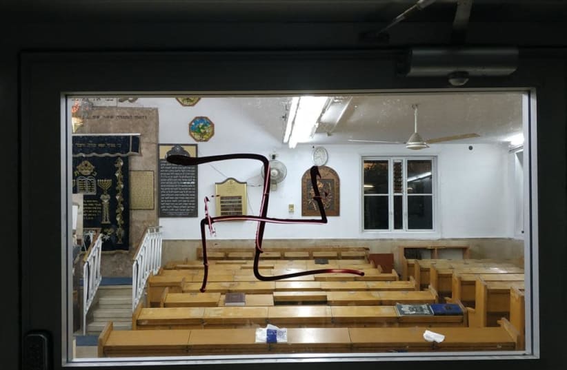 Swastika scrawled on synagogue in Bnei Brak, July 2021 (photo credit: ISRAEL POLICE)