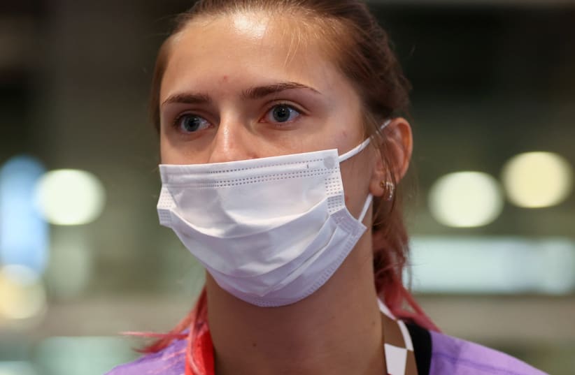 Belarusian athlete Krystsina Tsimanouskaya is seen at Haneda international airport in Tokyo, Japan August 1, 2021 (photo credit: REUTERS)