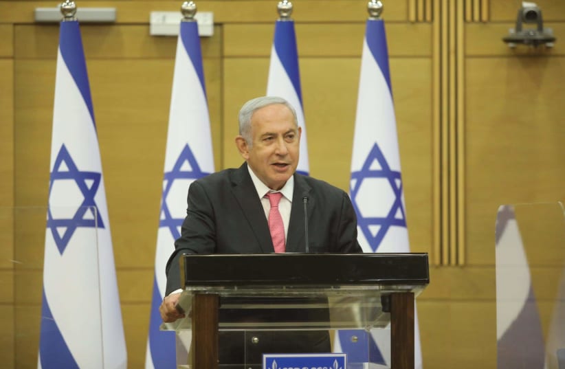 BENJAMIN NETANYAHU speaking at the podium in Knesset, August 2, 2021 (photo credit: MARC ISRAEL SELLEM)