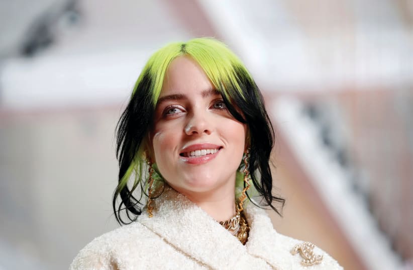 BILLIE EILISH in Chanel during the Oscars arrivals at the 92nd Academy Awards in Hollywood in February 2020.  (photo credit: MIKE BLAKE/ REUTERS)
