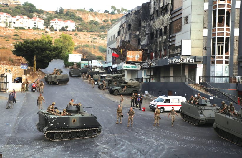 LEBANESE ARMED FORCES soldiers are deployed after an ambush on Shi'ite mourners in Khaldeh, Lebanon, on Sunday, August 1, 2021. (photo credit: MOHAMED AZAKIR / REUTERS)