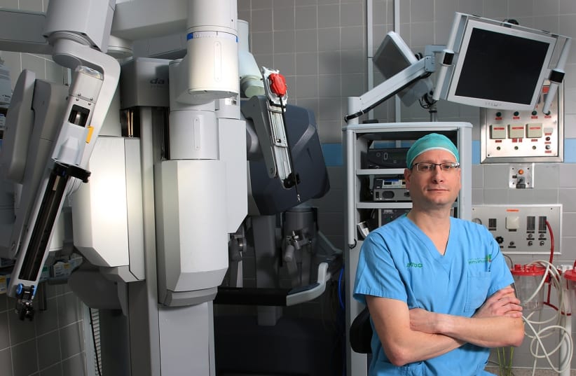Dr. Shay Golan with his roboto (photo credit: COURTESY BEILINSON HOSPITAL)