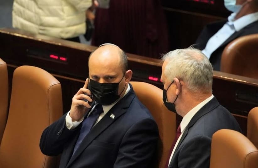 Prime Minister Naftali Bennett and Defense Minister Benny Gantz were updated about rocket fire from Lebanon while in the Knesset plenum.August 4, 2021. (photo credit: KNESSET SPOKESMAN'S OFFICE)