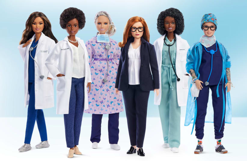 An undated handout image of a Barbie doll made in the likeness of Sarah Gilbert (3d R), the Oxford University professor who co-designed the Oxford/AstraZeneca vaccine, among a global lineup of women of healthcare sector honoured with a one-of-a-kind doll. (photo credit: UNIVERSITY OF OXFORD/VIA REUTERS)