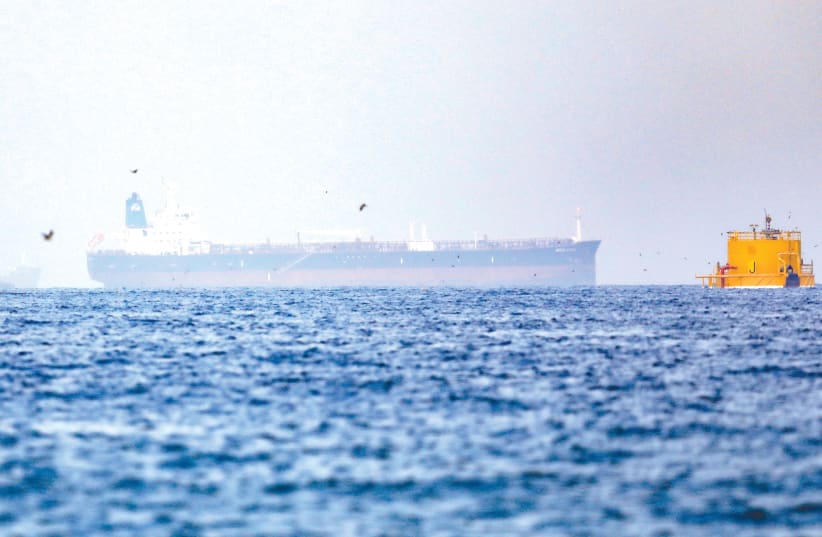  ‘MERCER STREET,’ a Liberian-flagged, Japanese-owned and Israeli-managed ship, that was attacked – apparently by Iran – off the coast of Oman, is seen near Fujairah Port in United Arab Emirates, on Tuesday. (photo credit: Rula Rouhana/Reuters)