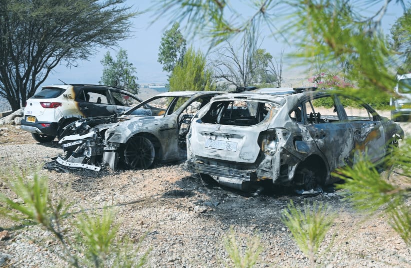  THE SITE where 5 vehicles were burned last month at the Vered Hagalil Holiday Village lot near Korazim, next to the Sea of Galilee. Police suspect this was a deliberate arson by criminals who extort protection fees from businesses in the North.  (photo credit: MICHAEL GILADI/FLASH90)